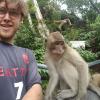 This young monkey held my finger with his little hands and sat on my lap