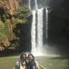 Me and my friend on a boat by the falls