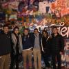 My friends and I outside the famous Lennon Wall in Prague-- there was a lot of graffiti promoting peace and love