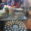 Fresh steamed putu, flaky rice filled with sugar cane