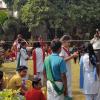 In this race, girls on one end of the field have their hair braided as quick as possible by their partners