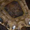 The ceiling of the entrance to the Royal Palace. Notice the beauty and detail of the painting and carvings around it