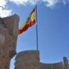 Spanish flag waving at the top of the Alcázar
