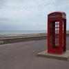 It's a bit strange to see a red telephone box here, because phone boxes like these are typically British!