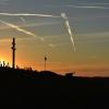 The sunset painted the sky a vivid medley of colors and in the distance, a flag waved next to an Orthodox cross