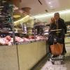 A butcher prepares fresh cuts of meat every day here at La Grande Épicerie