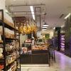 Dried and cured meats, like ham and sausages, hang from the ceiling!