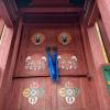 The doors to the Buddhist temple were brightly painted