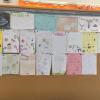 The students even fill the classroom with beautiful artwork and English compositions