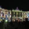 See the bright green spot on the left? That's one of the powerful projectors that was illuminating the buildings