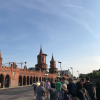 The Oberbaum Bridge crosses the Spree River in Berlin and connects the neighborhoods of Friedrichshain and Kreuzberg