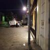 A street cleaning vehicle late at night