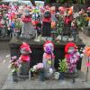 Each little statue and red hat represents one family's child. There are statues for both children who have passed away and those who are sick. They are supposed to represent safety for the future.