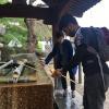 Before entering the temples and shrines, it is Buddhist tradition to wash one's hands. Here I am preparing to wash my hands, allowing me to be clean and purified. 