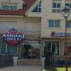 An American-style restaurant with hot wings, Philly cheese steak and cheese fries