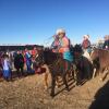 A parade of children on horses. Take a look at their traditional clothes!