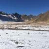 The snow brushes the rugged landscape. 