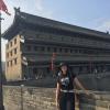 Standing in front of the guard tower on the city wall