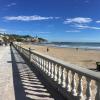 The promenade stretches all along the coast of this beach town. In the distance, you can see the main church.