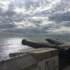 An old cannon, used to defend Sitges from the British half a century ago. You can also see little sailboats out at sea.