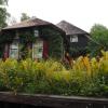 Here is a better view of an old traditional Dutch house. You can see the bright red paint and straw roof.