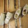 From left to right is the stages of making wooden clogs! Wooden clogs are the traditional shoes of The Netherlands!