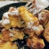 Kaiserschmarrn is a fluffy pancake that is chopped up