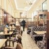 Coffee houses like Cafe Mozart are very fancy. How many chandeliers do you see?