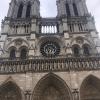 A close up view of Notre-Dame, a church that was originally built in 1160, and is constructed in the French Gothic style of architecture