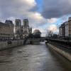 Here, the Seine river flows past Notre-Dame Cathedral, a medeival Catholic church and famous French landmark
