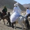 A Kazakh couples' game where women chase after the man they like on horseback
