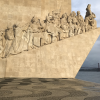 A statue on the shore commemorating the Portuguese conquistadors, people who conquered new territory for their country, often at the expense of the native peoples