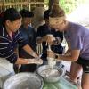 Learning how to make rice noodles, an important part of the Lao diet