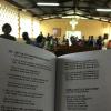 The inside of a Togolese church, featuring a hymnal written in the languages French and Ewe