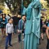 Someone dressed up on stilts as The Statue of Liberty!