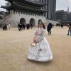 Wearing a beautiful traditional outfit called hanbok at Gyeongbokgung Palace