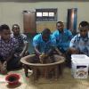 Men of the Cuvu Village preparing kava during a Kalevu i-sevusevu ceremony