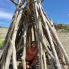 Sitting in a beach hut made to help prevent sand erosion