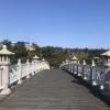 You have to cross the Seonimgyo bridge across a stream from the waterfalls at Cheonjeyeon Falls to see the final waterfall