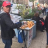 A man selling food on the corner in Viña del Mar