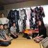 These women on the left are going to help us put on our yukatas, which can be seen hanging in the background