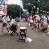 The drum performers all wore special traditional clothes with a white shirt with a purple and gold phoenix on it 