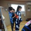 Here, two of the women are deciding on a bow that best fits the yukata