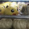 These are baozi, which are steamed buns filled with meat, vegetables or bean paste... does this baozi look familiar? 