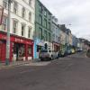 The weather in Ireland is often cloudy but it remains vibrant due to the beautifully colored storefronts
