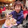 My friend’s mom enjoying a nice traditional Osaka dish called Takoyaki