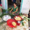 Special foods like the cakes this woman is making are often made during Khmer New Year