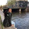 This is Kripa sitting by one of the many many bridges in Amsterdam going over the Amstel River