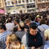 People gather in the streets to watch the Mascaleta, or the daytime fireworks display which was very loud