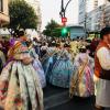 During Las Fallas, people parade through the city wearing traditional clothes and accompanied by bands